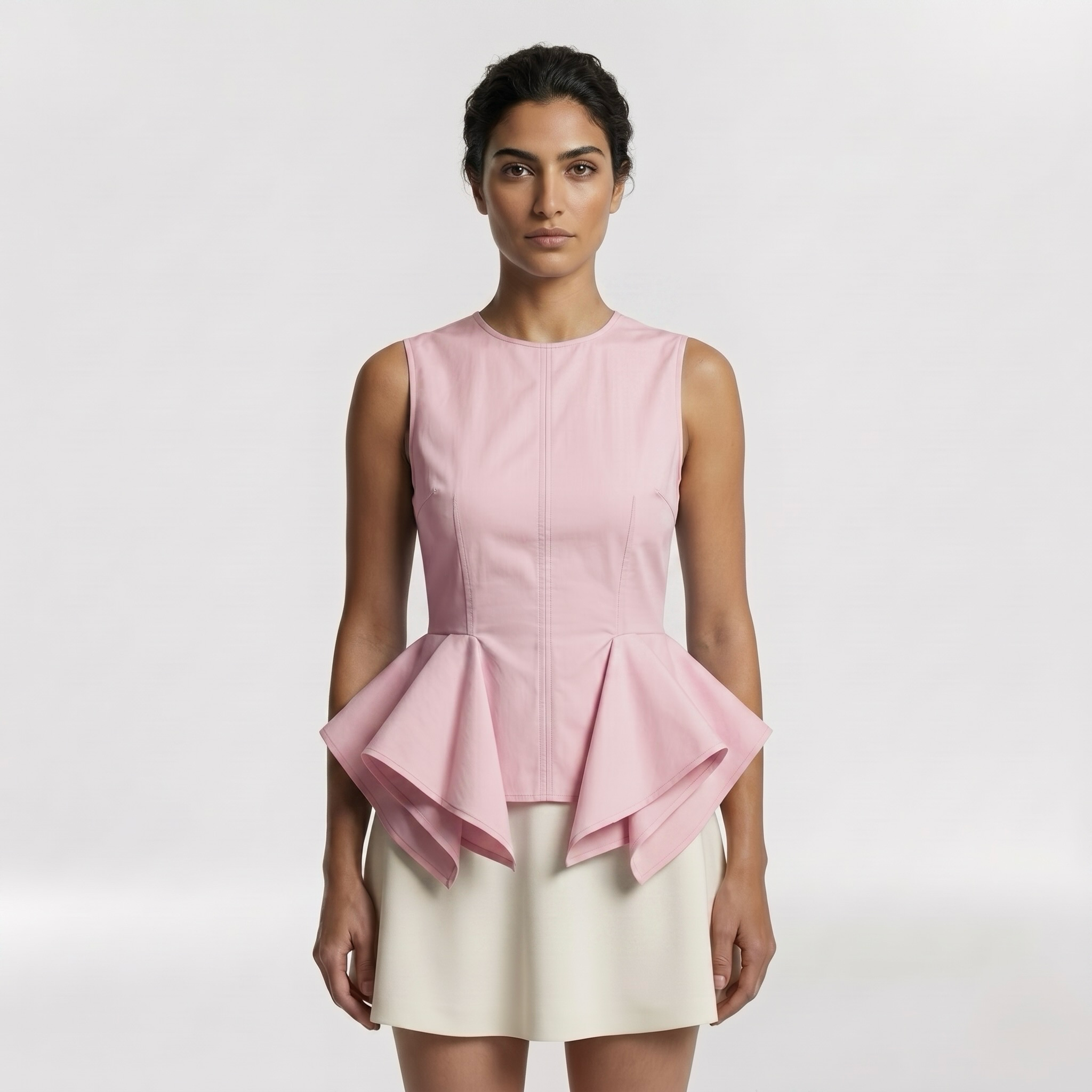 Architectural Peplum Sleeveless Top with Fitted Bodice and Structured Volume