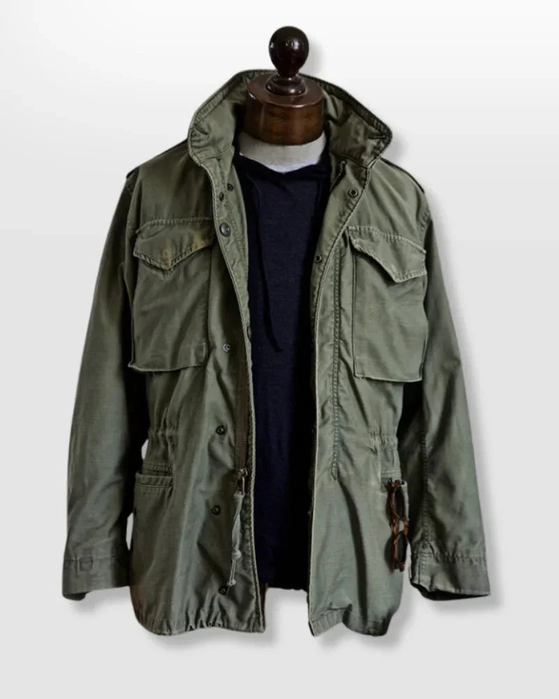 Men's durable utility field jacket designed for outdoor activities, featuring multiple pockets for storage and a rugged, weather-resistant fabric suitable for various environments. 0
