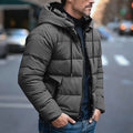 Men's insulated quilted puffer jacket featuring an adjustable hood, designed for warmth and comfort in cold weather. 0