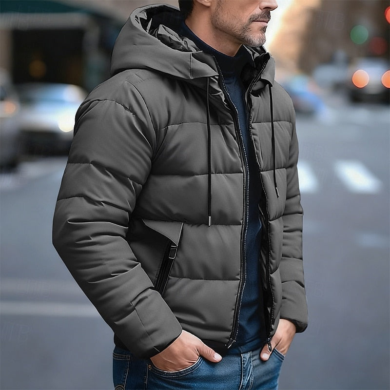 Men's insulated quilted puffer jacket featuring an adjustable hood, designed for warmth and comfort in cold weather. 0