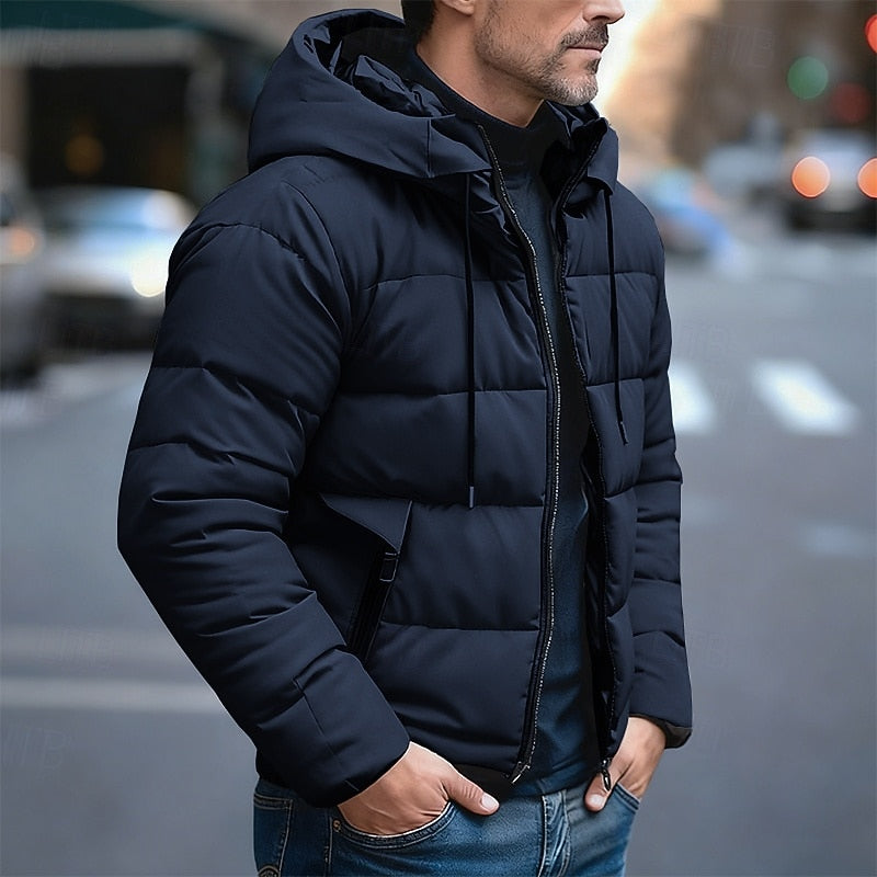 Men's insulated quilted puffer jacket featuring an adjustable hood, designed for warmth and comfort in cold weather. 1