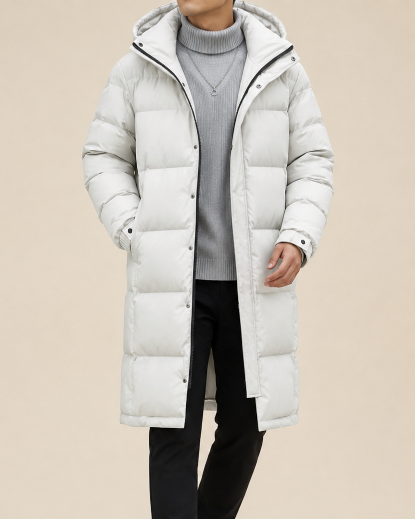 Men's longline quilted winter coat featuring a hood and snap-button cuffs, ideal for warmth and style in cold weather. 3