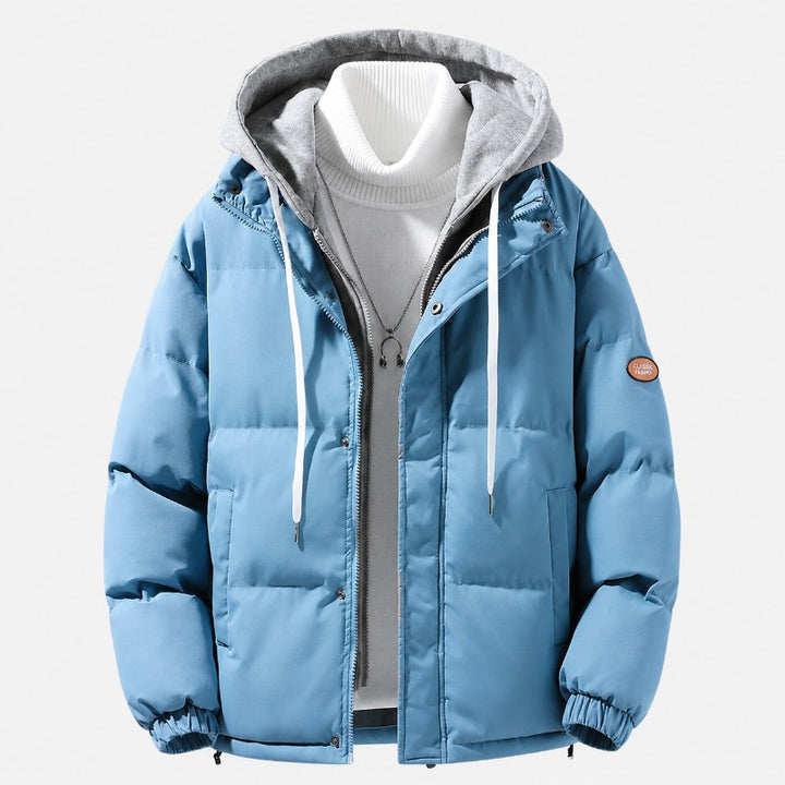 Men's quilted hooded puffer jacket featuring adjustable cuffs and hem, perfect for winter warmth and style. 0