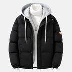 Men's quilted hooded puffer jacket featuring adjustable cuffs and hem, perfect for winter warmth and style. 1