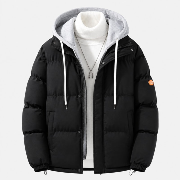 Men's quilted hooded puffer jacket featuring adjustable cuffs and hem, perfect for winter warmth and style. 1