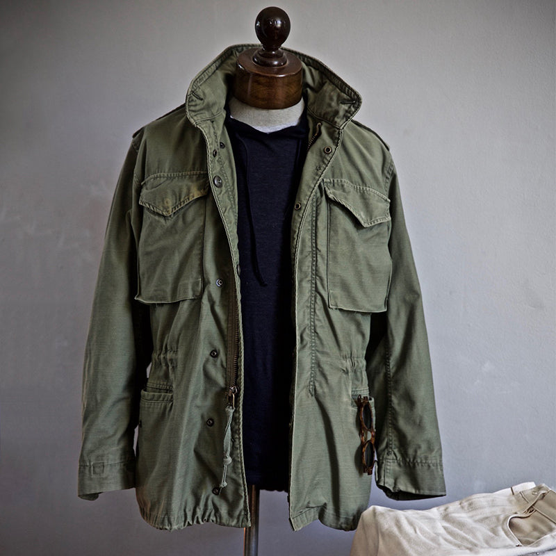 Men's utility field jacket featuring multiple functional pockets, ideal for outdoor activities and everyday wear, made from durable materials for versatility and comfort. 0