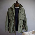 Men's utility field jacket featuring multiple functional pockets, ideal for outdoor activities and everyday wear, made from durable materials for versatility and comfort. 0