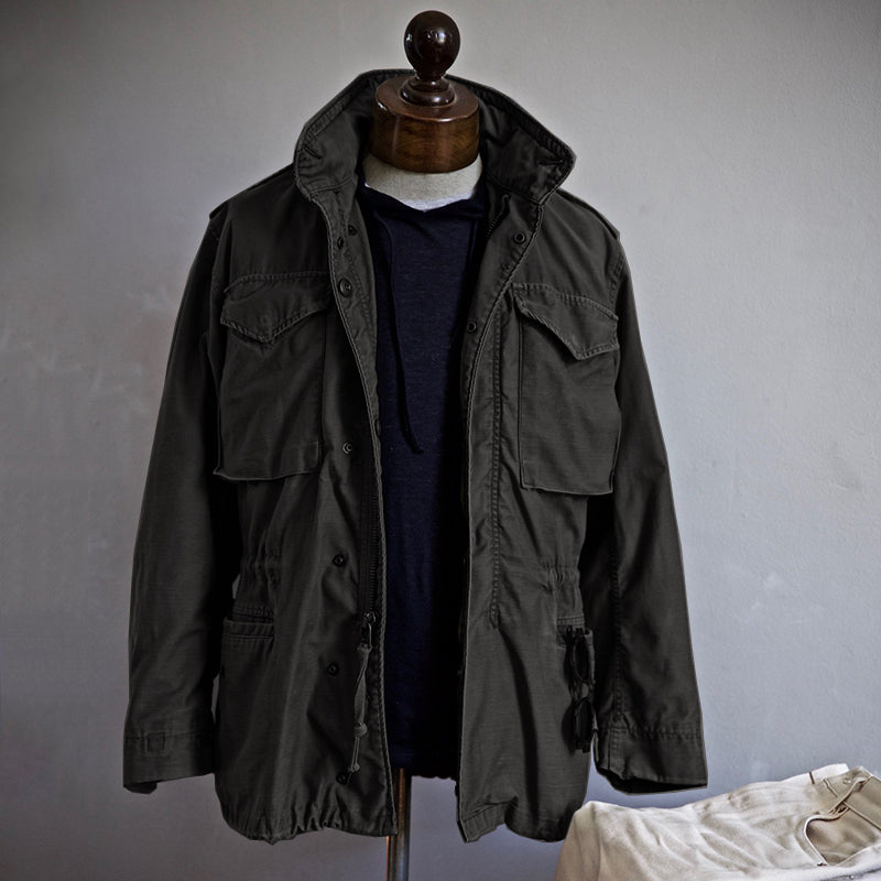 Men's utility field jacket featuring multiple functional pockets, ideal for outdoor activities and everyday wear, made from durable materials for versatility and comfort. 1